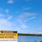 Sewage discharge warning sign at Buller River, Westport