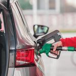 Close-up of a Person Refueling the Car at a Gas Station