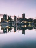 Photo of Auckland skyline with reflection on the harbour