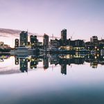 Photo of Auckland skyline with reflection on the harbour